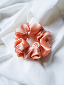 "Coral silk baby scrunchie